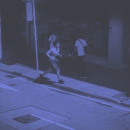 A man running down a sidewalk